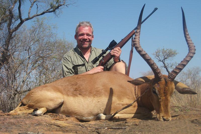 Hunters with trophy Impala on a South African plains game safari with Mediate Expeditions.