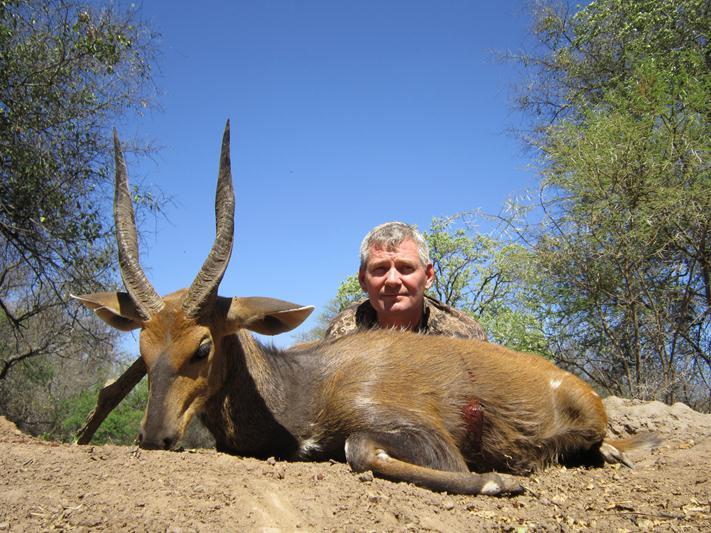 Hunter with trophy Bushbuck during a South African plains game safari with Mediate Expeditions.