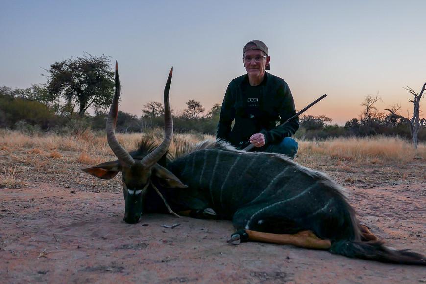 Hunter with trophy Nyala during a South African plains game safari with Mediate Expeditions.